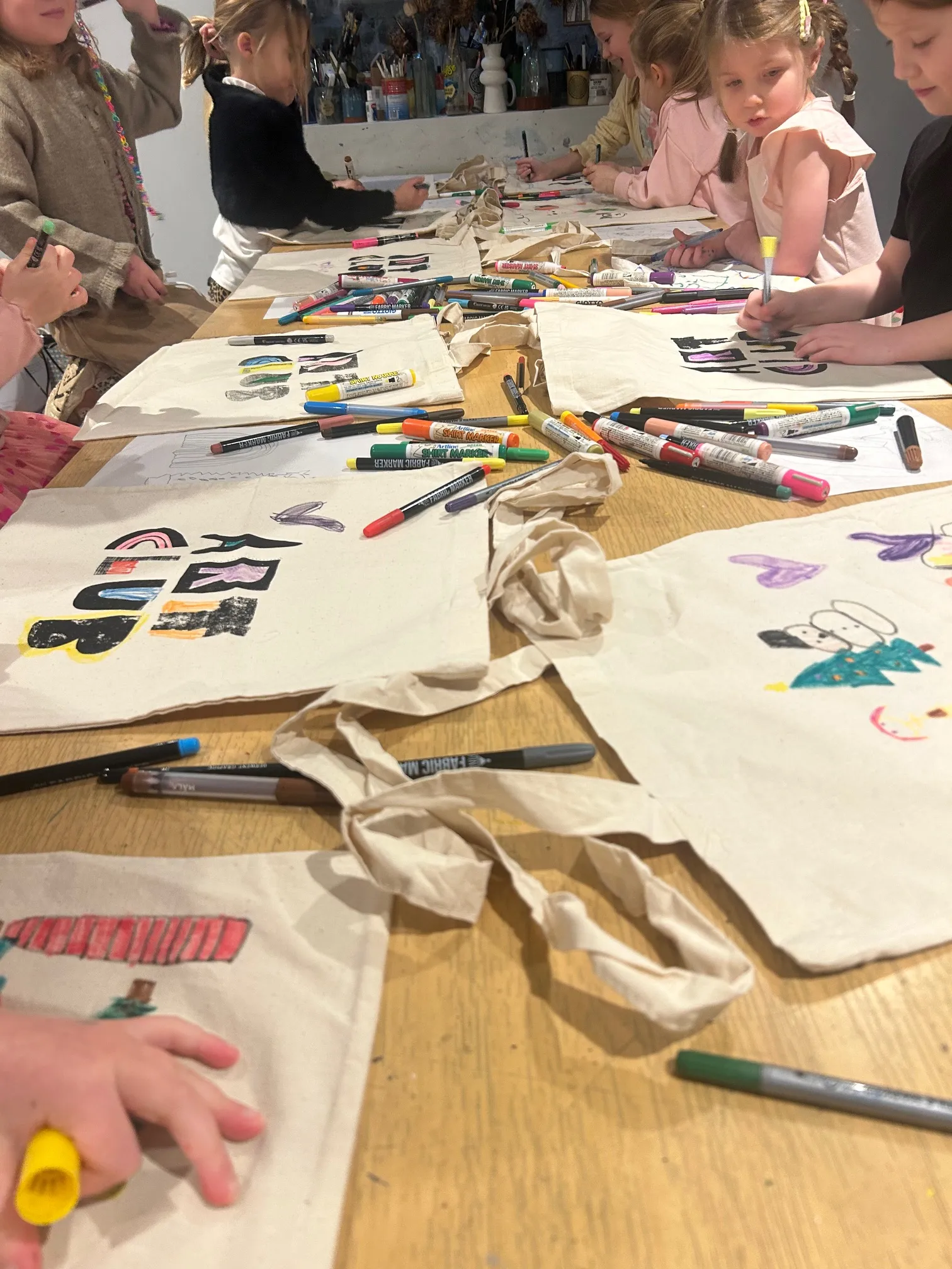 Young guests painting and crafting at an Art Club children's party